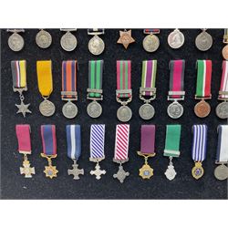 Two limited edition large framed display boards with half-size copies of British Gallantry and Campaign Medals produced by Danbury Mint and entitled 'For Valour'. Sixty medals on each board, all with ribbons. Complete with Danbury Mint certificate serial number A0148 and other paperwork.