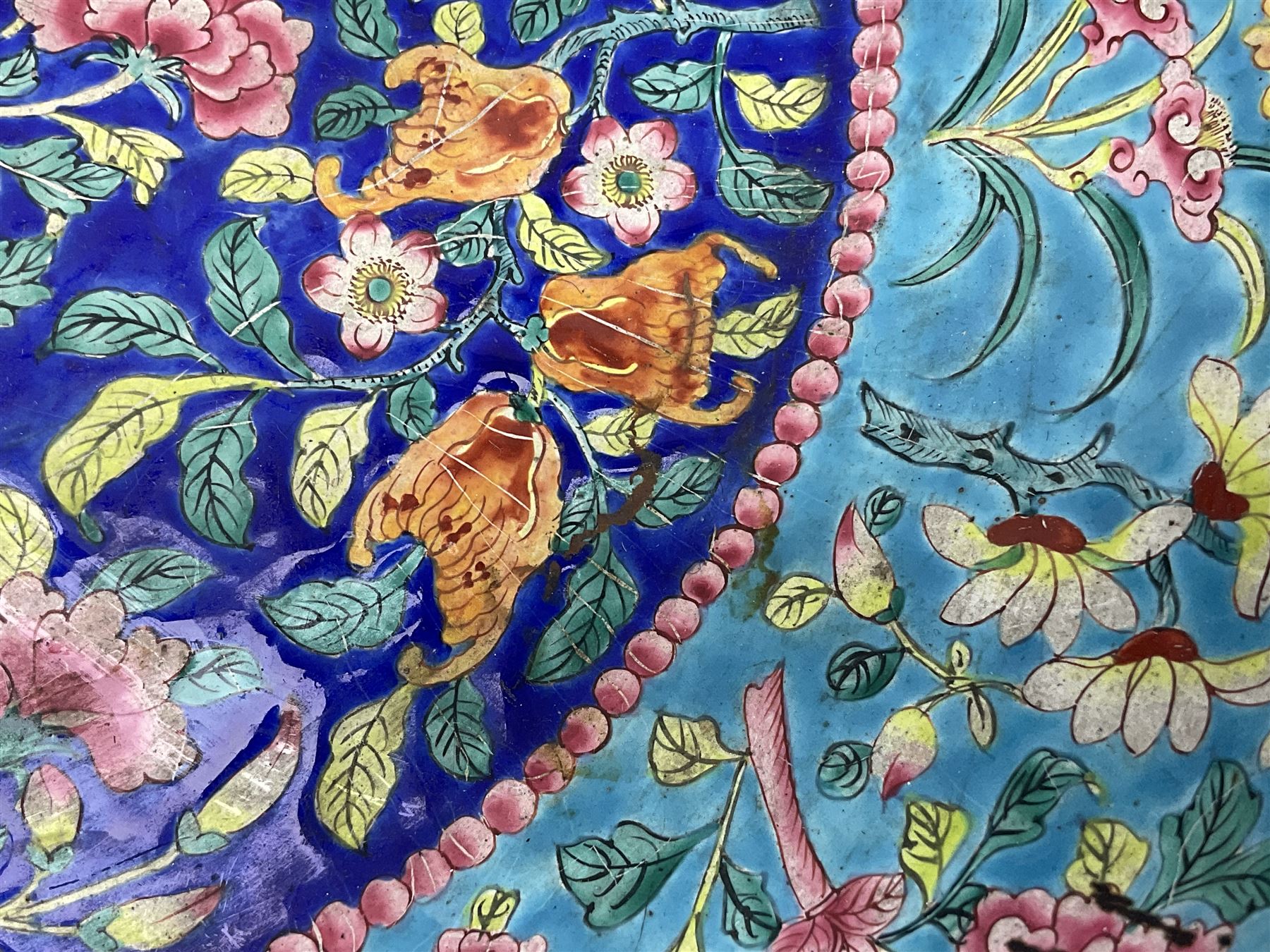 18th/19th century Chinese Canton enamel basin, the circular basin with flat everted rim, decorated with scrolling foliate and fruit decoration on a blue ground, D43cm