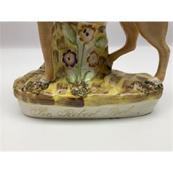 19th century Staffordshire figure of Robert Peel, titled 'Sir Robert Peel', modelled on horseback, atop an oval plinth base featuring a naturalistic and floral design, H30cm 
