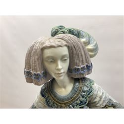 Large Lladro figure, La Menina, modelled as a maid of honor in service, on a mahogany oval base, limited edition 99/1000, sculpted by Jose Puche, with certificate of authenticity, framed and glazed, no 1812, year issued 1996, year retired 2019, H60cm