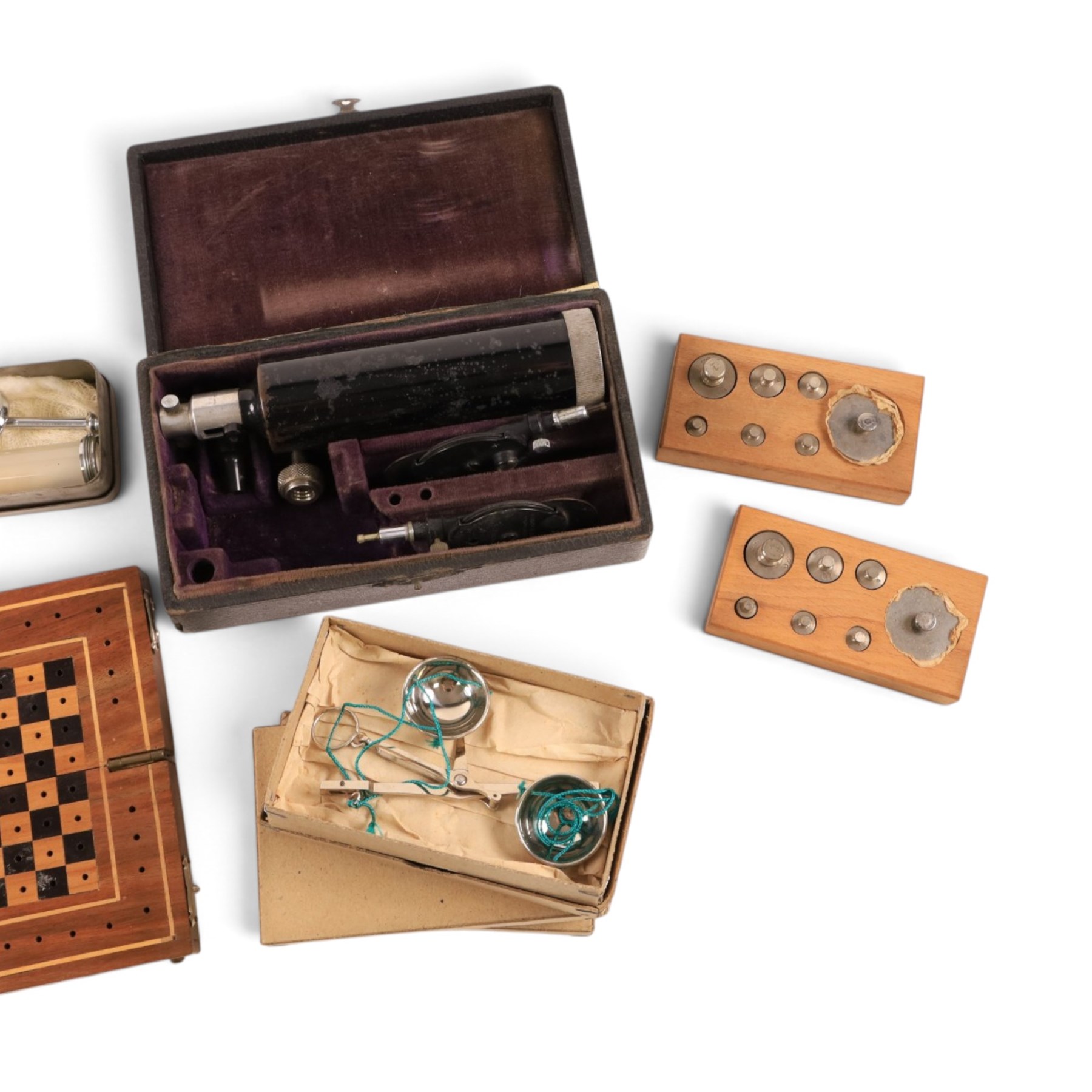 Field medical equipment, including scalpels, syringe, small weights and scales, ophthalmoscope, etc, contained within a steel uniform case
