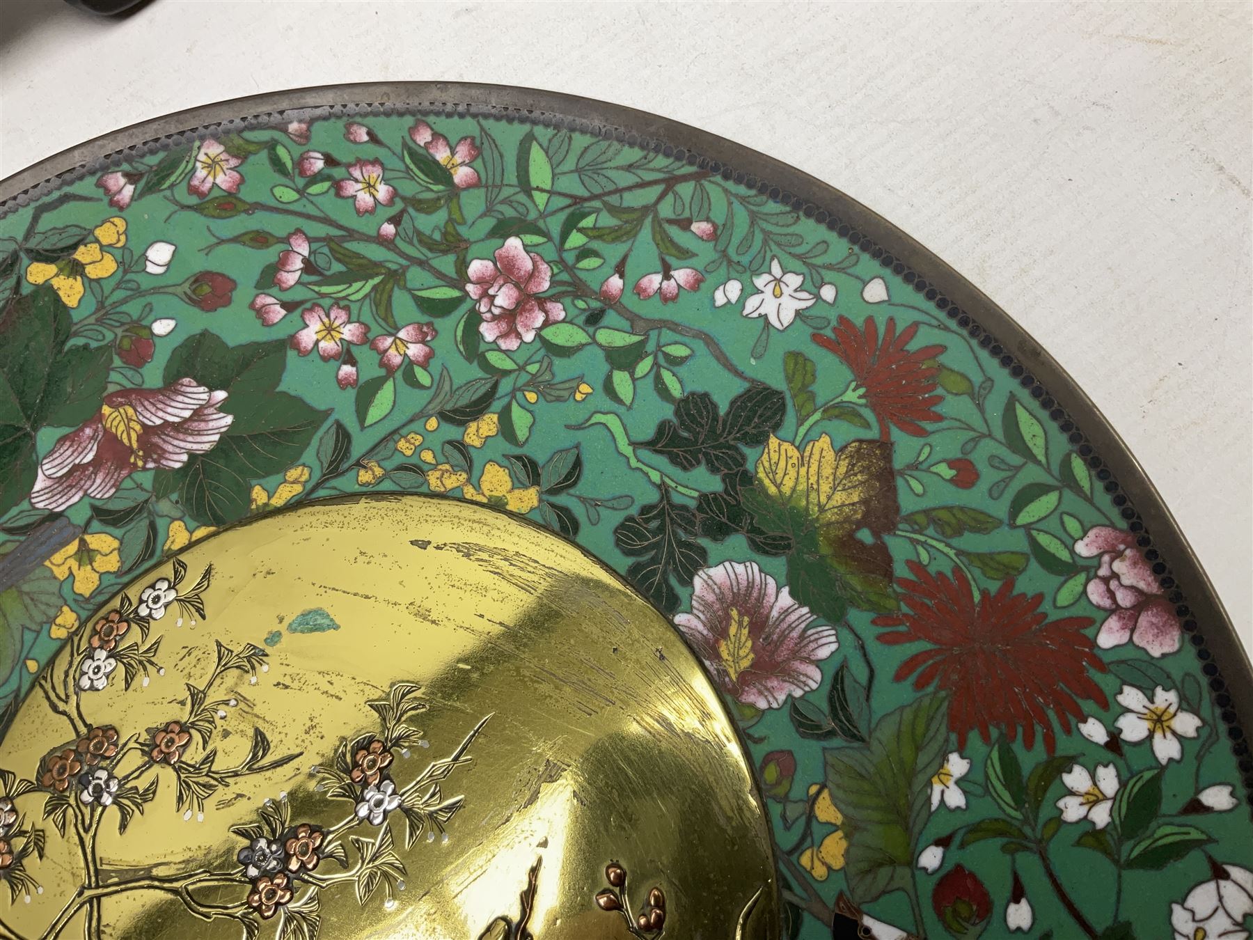 Cloisonné plate decorated with birds and flowers, together with a pair of Cloisonné vases of baluster form 