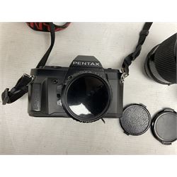 Pentax P30 SLR camera with SMC Pentax-A 1:1.7 50mm lens, Sigma Super-Wide II 1:2,8 lens and Vivitar 70-210mm lens