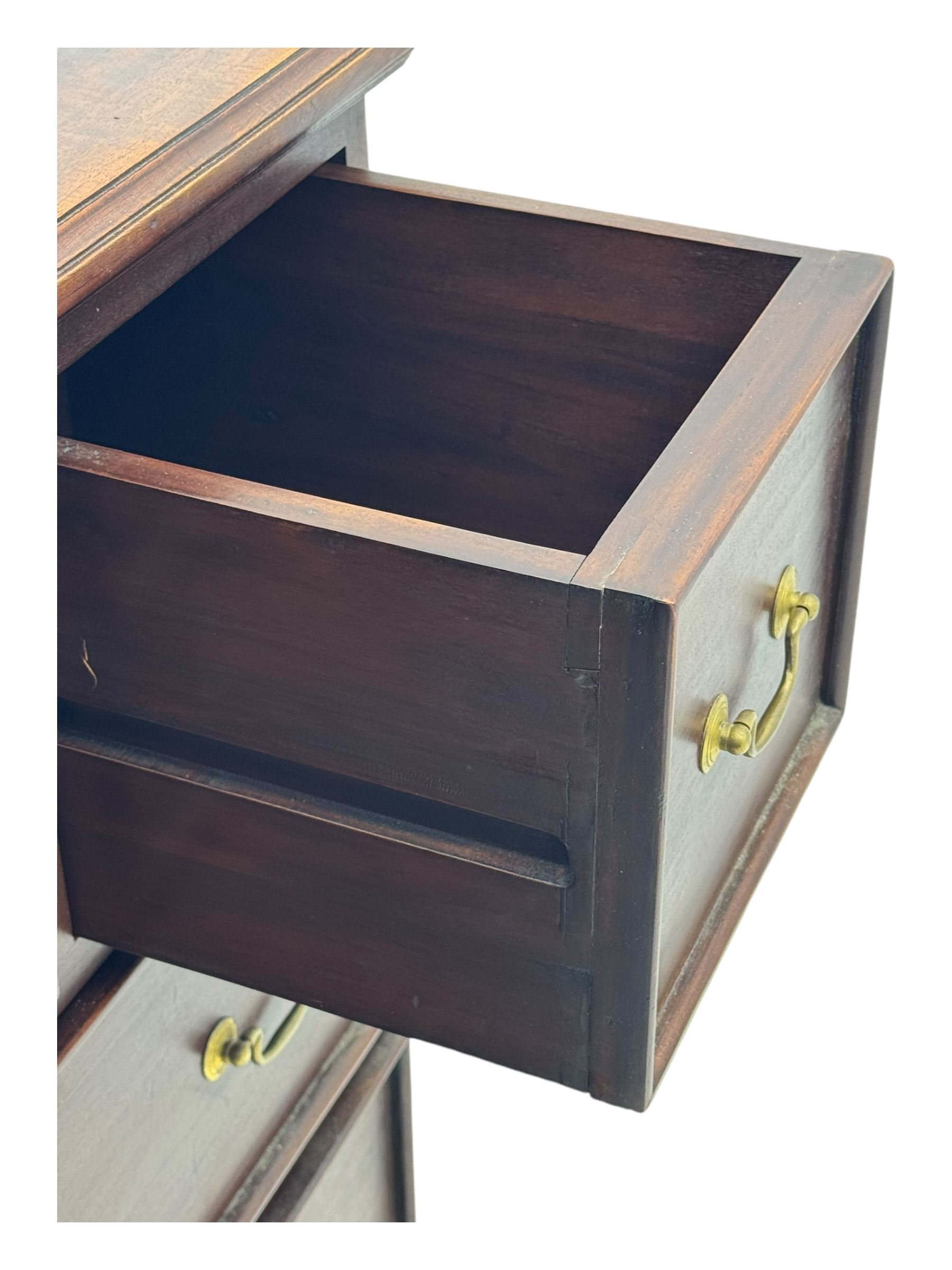 Georgian design mahogany chest, fitted with six drawers, on ogee bracket feet