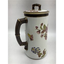 Royal Worcester coffee pot, coffee cup and saucer, all decorated with floral sprigs and butterflies, the coffee pot with a bamboo handle, H23cm