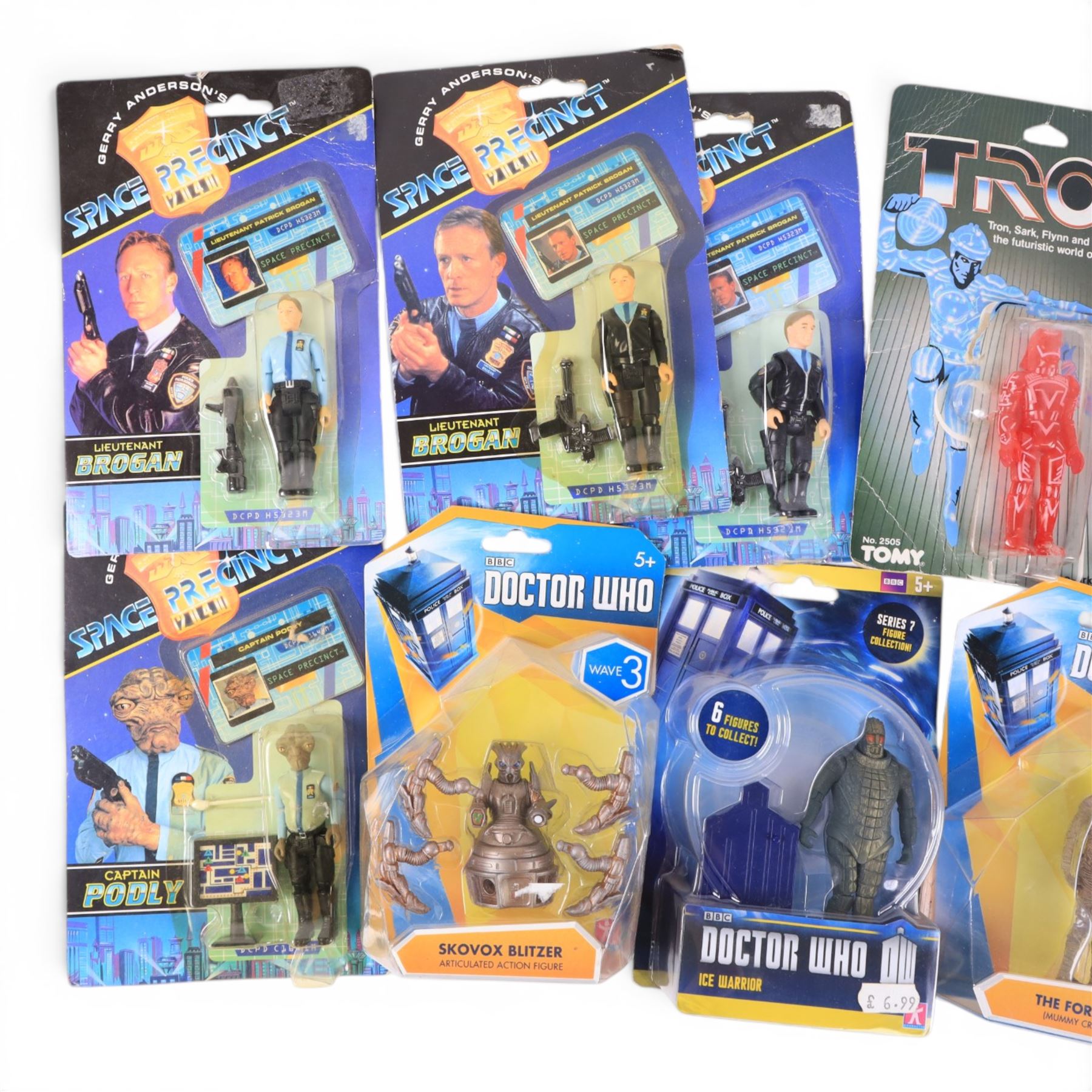 Nine TV & Film figures, comprising Neca 20th Anniversary Disney's Tron Sark, Tomy Disney's Tron Sark, four Gerry Anderson's Space Precinct Lieutenant Brogan and Captain Podly figures and Character Doctor Who Skovox Blitzer, Ice Warrior and The Foretold figures, together with a Bandai Terrahawks Zig-Zag Mini Wind Up Battlehawk, all carded