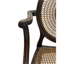 Mid-to late 20th century walnut Hepplewhite design elbow chair, circular cane back with pierced and carved central rosette, fluted frame with scrolling arms, cane seat raised on fluted rail and square tapering supports with spade feet