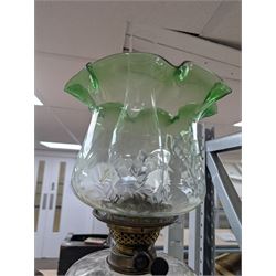 Oil lamp with frilled green glass shade, glass reservoir, upon upon corinthian column with stepped circular base, H74cm