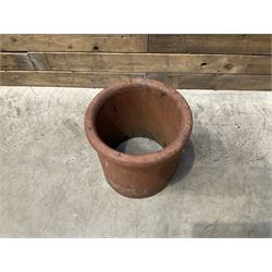 Cast iron cauldron set pot with 2 terracotta chimney pots and 2 terracotta planters,