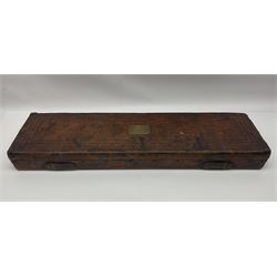 Leather shotgun case, the red baize lined interior with the trade labels of Westley Richards & Co., London, a brass plaque inscribed 'T Nevin, Mirfield, Yorkshire' to cover, with key, case to fit barrel 76cm (30 inches)  
