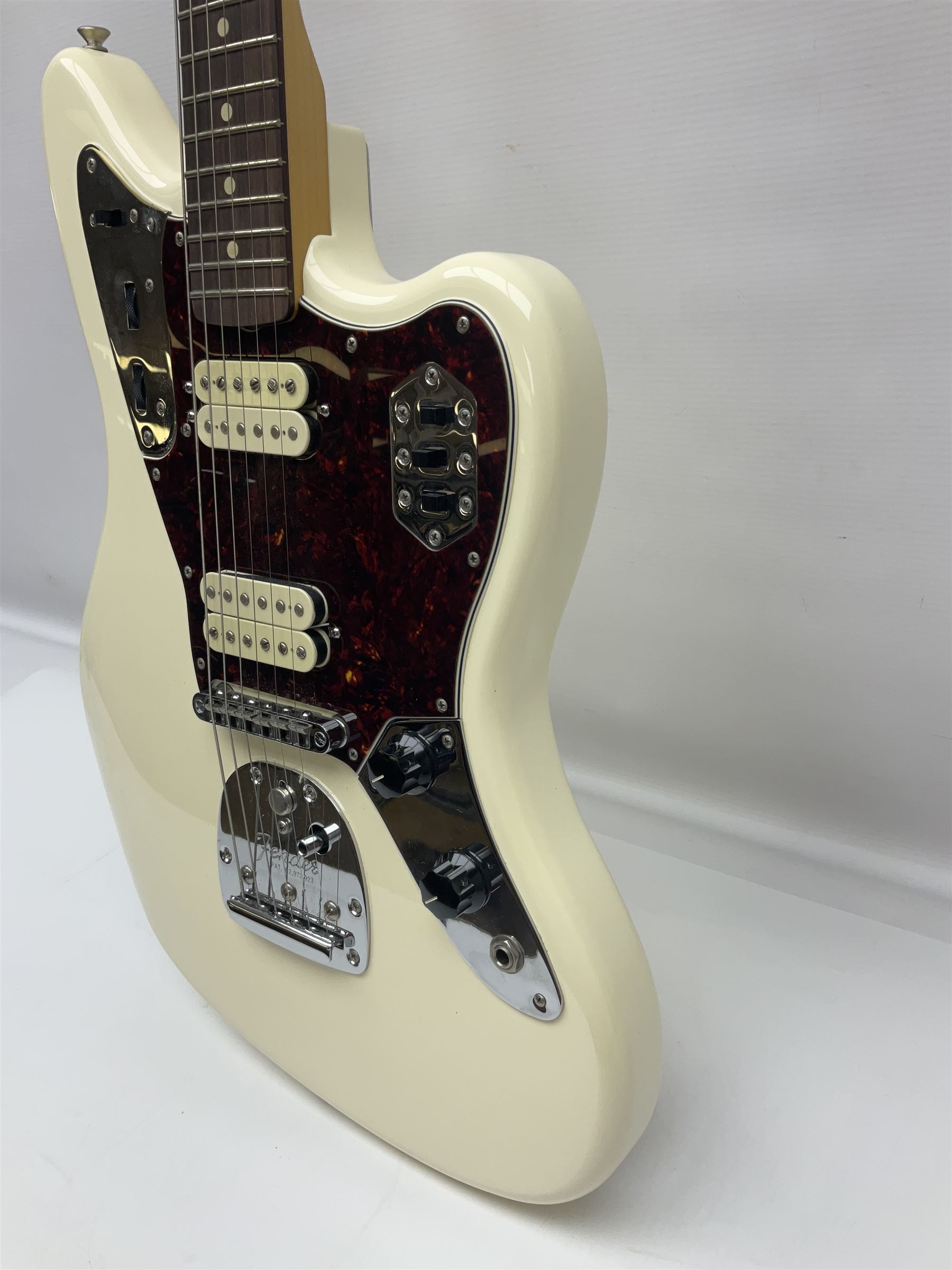 Mexican Fender Jaguar electric guitar with Humbucker pick-ups and tremolo arm, serial no.MX16741977, L101cm; in soft carrying case