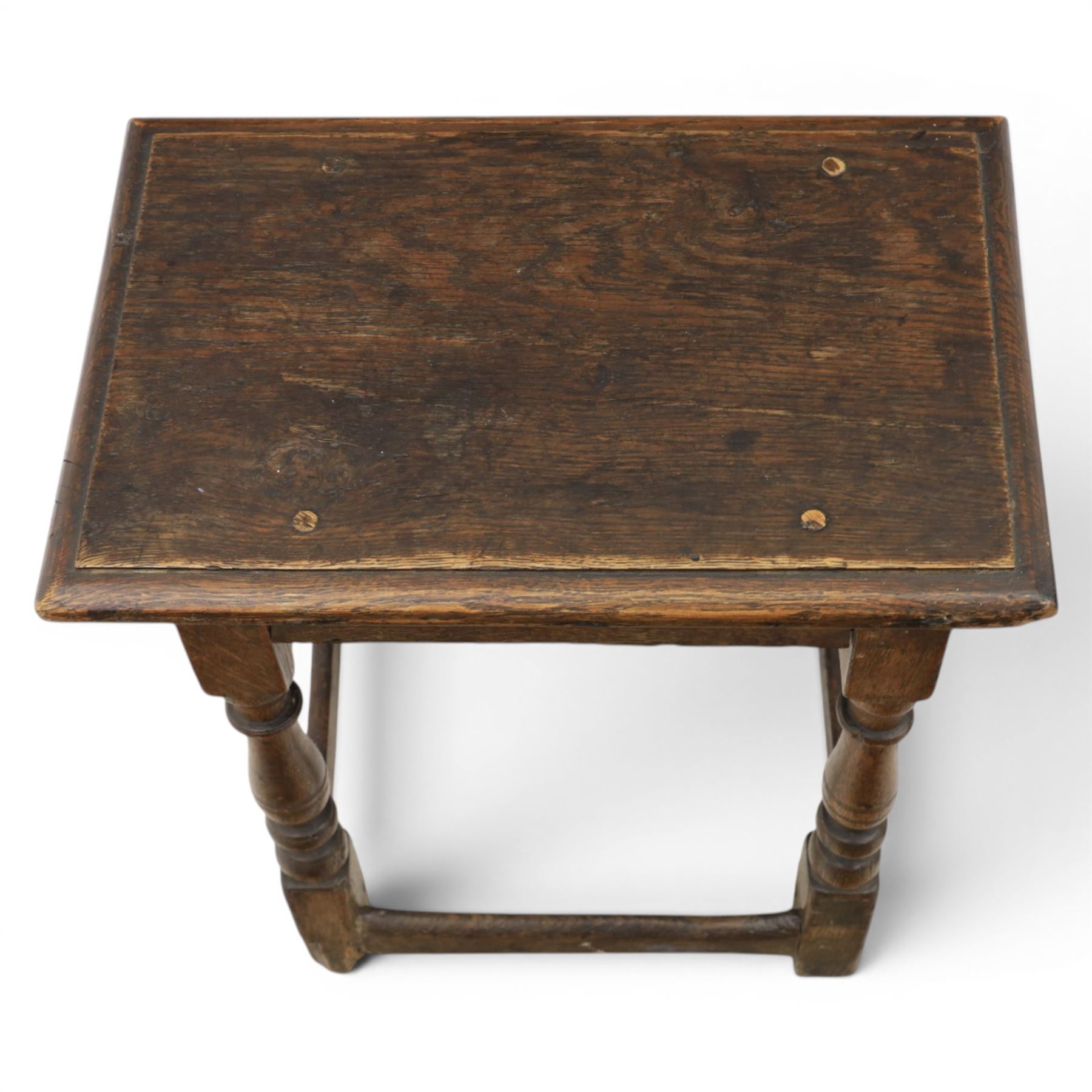 Two 19th century oak joint stools raised on turned supports united by stretchers