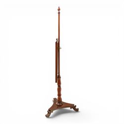 Two Victorian fire screens, comprising mahogany pole screen with glazed floral woolwork panel on turned support and triform base (H 142cm, W 48cm); and a larger carved walnut tapestry fire screen, glazed panel depicting a domestic interior scene, scroll carved cresting, barley twist uprights and turned stretcher base (H 75cm, W 49cm)