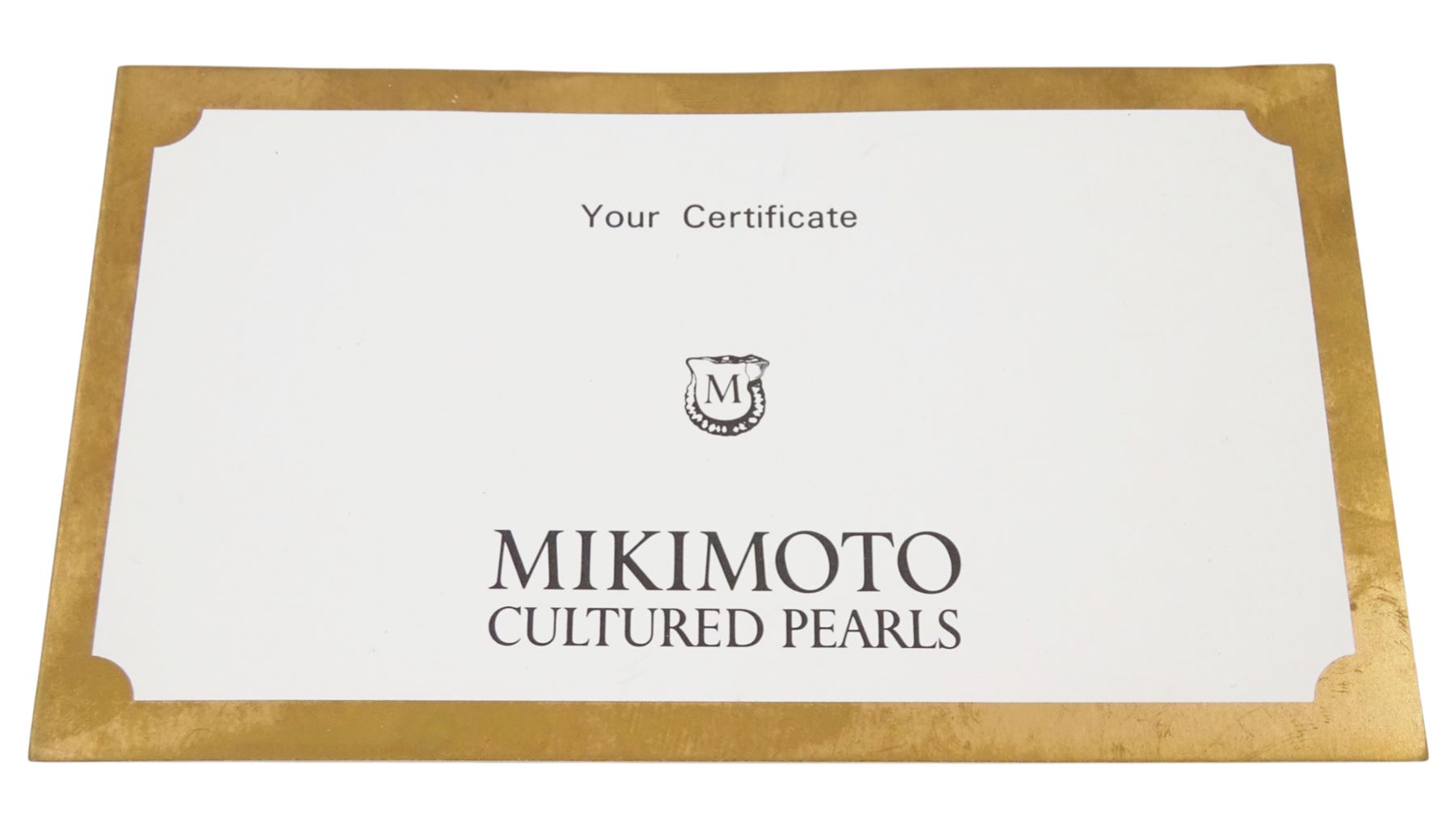 Mikimoto single strand cultured white pearl necklace, with 18ct gold clasp, stamped 750, boxed with certificate dated 1983