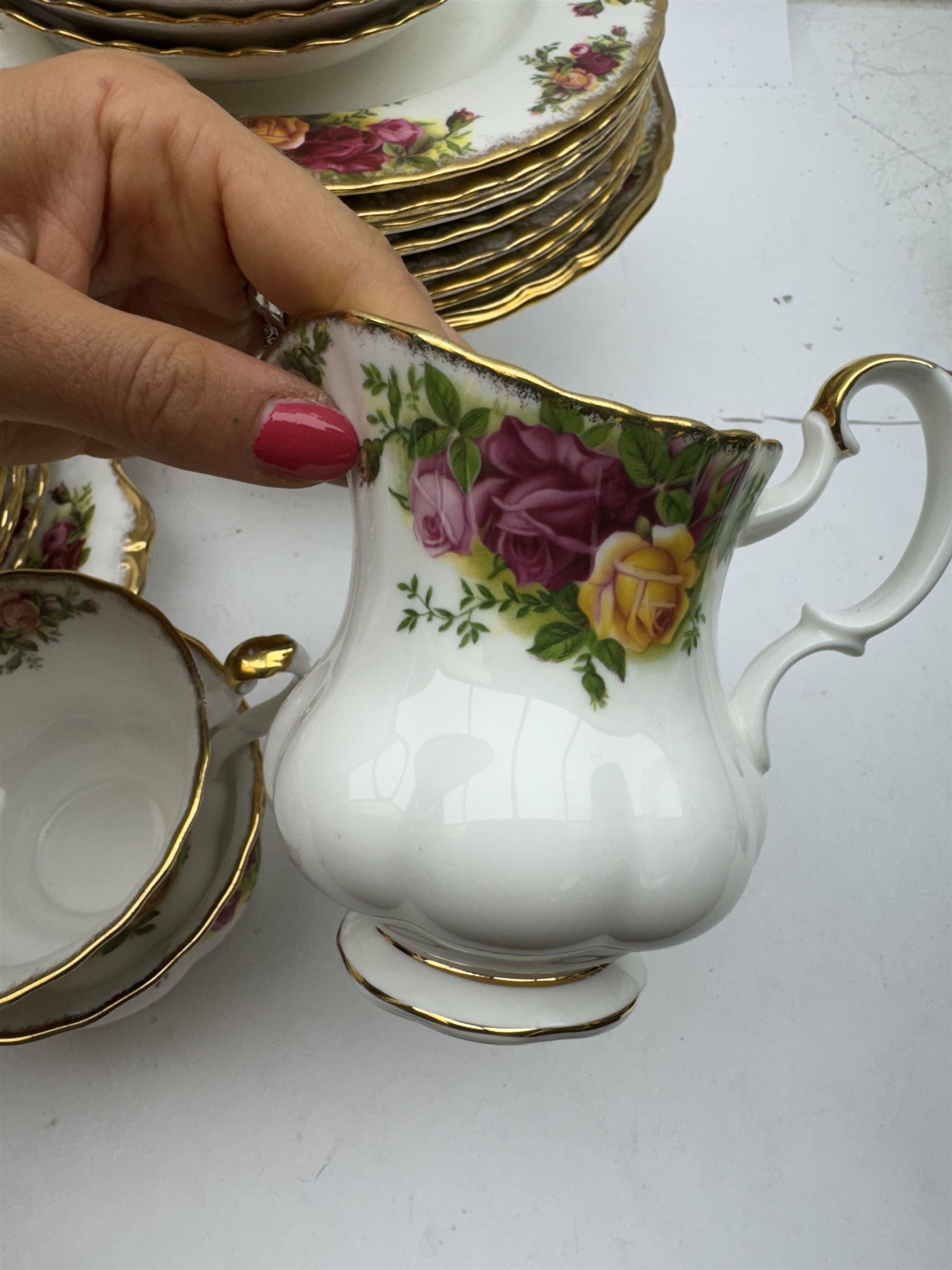 Royal Albert Old Country Roses pattern tea wares, comprising coffee pot, jug and sugar bowl, cake stands, napkin rings, teacups and saucers, side plates, dessert plates, small plates, all with printed marks beneath