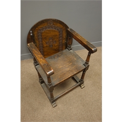  Early 20th century oak monks chair, guilloche carved tilting back, turned supports, square stretchers, sledge  feet, W70cm  