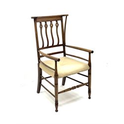 Early 20th century Arts and Crafts style fruitwood elbow chair, the C-scroll top rail with curving supports, pierced and wavy rail back, upholstered seat and turned front legs and stretcher H101cm W54cm D61cm