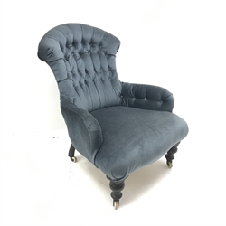 Victorian spoon back armchair upholstered in a deep buttoned blue fabric, turned supports, W72cm
