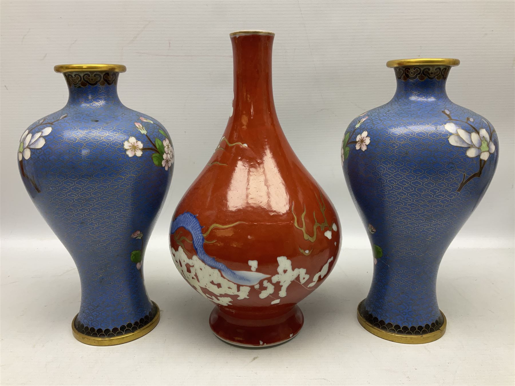 20th Century Japanese vase decorated with a blue dragon and gilding upon red yellow ground, bears Fukagawa Seiji mark (a/f), together with pair of blue cloisonné vases of baluster form decorated with blossom, and pair of Japanese vases, tallest H26cm