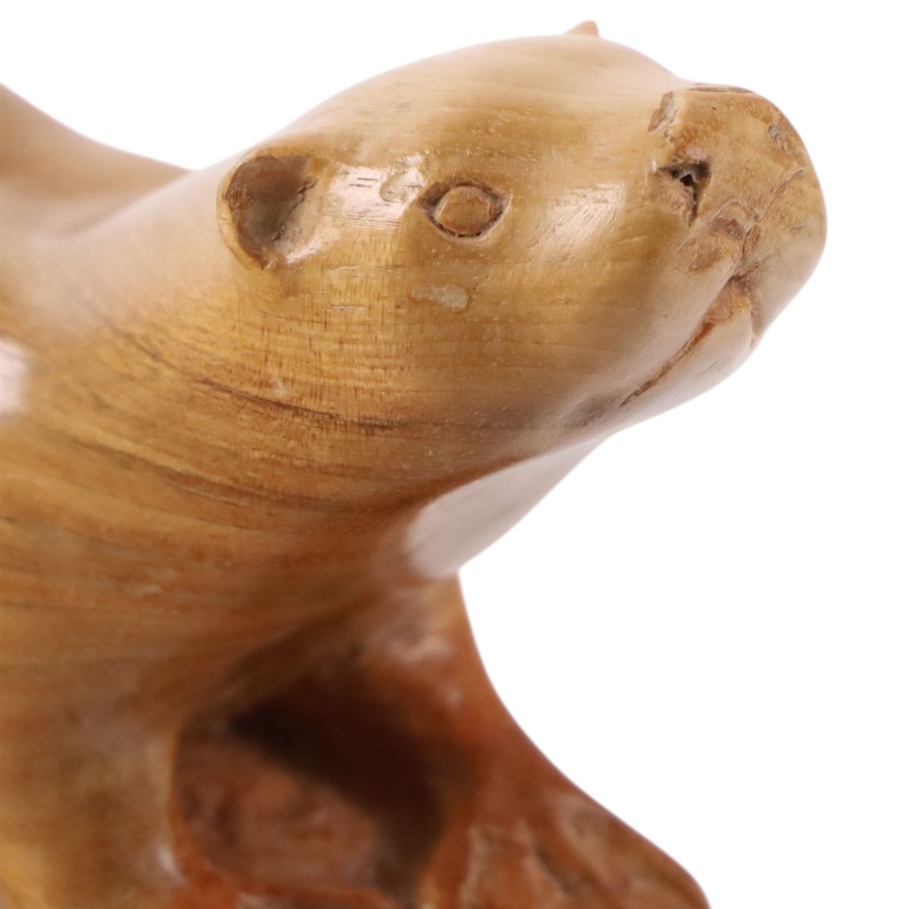 20th century walnut carvings, the first modeled as a wren, the second an otter, H  Two Yorkshire style walnut carvings, of a wren and otter, otter H10cm