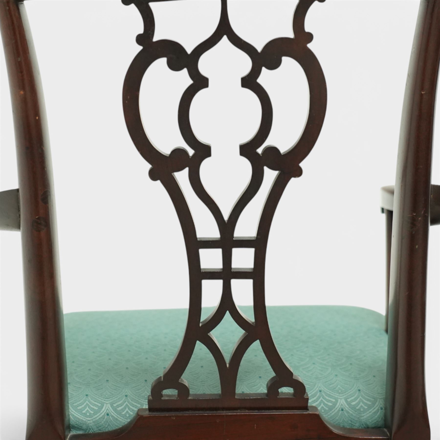 Georgian design mahogany elbow chair, the shaped top rail over a pierced vase shaped splat, swept open arms on square supports, upholstered drop-in seat, raised on cabriole legs terminating in pad feet