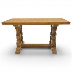 Mouseman - adzed oak rectangular coffee table, commissioned with four octagonal supports joined by chamfered stretcher terminating in sled feet, with carved mouse signature, by the workshop of Robert Thompson of Kilburn