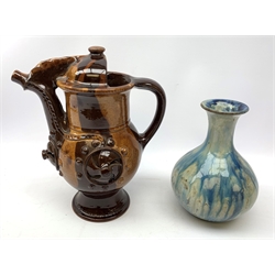  A dripware pottery vase of bulbous form, decorated with a merging blue and cream glaze, indistinct impressed marks beneath, H20.5cm, together with a treacle glaze coffee pot, H28cm.   