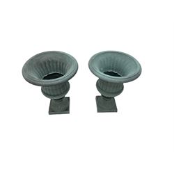 Pair Victorian design cast iron Campana shaped garden urns with base, with fluted and gadroon decoration in washed blue finish