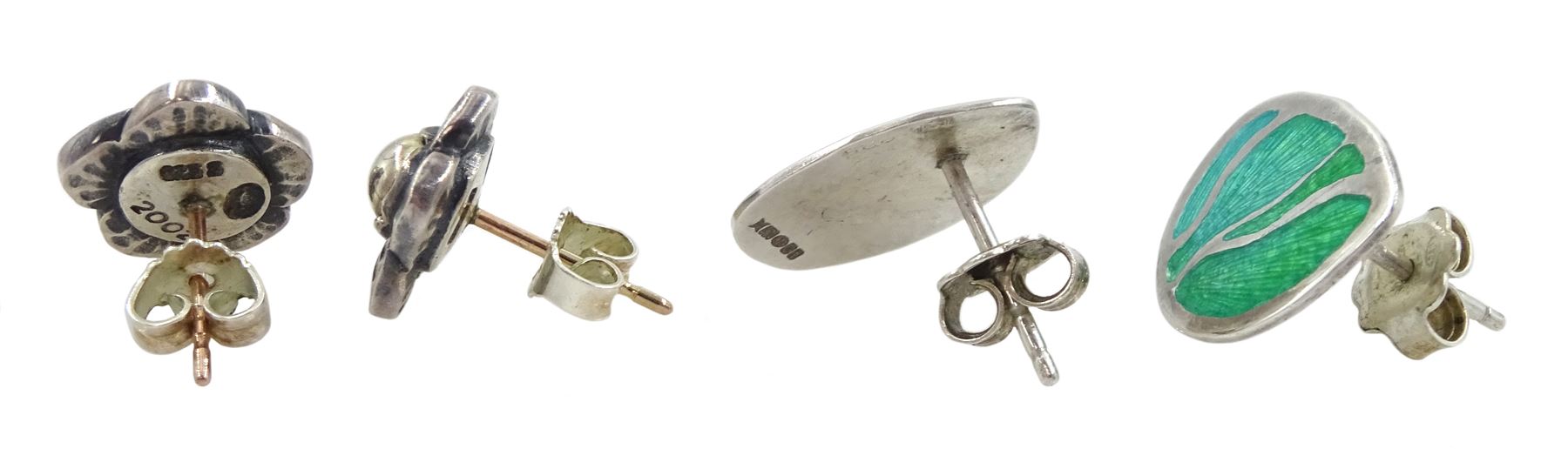 Pair of  silver flowerhead stud earrings by Georg Jensen No. 2002 and pair of Glazzard Lundsten silver enamel stud earrings