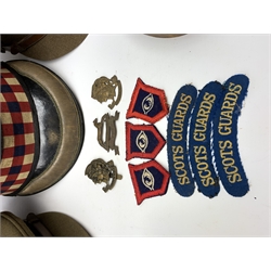 Scots Guards - two officer's peaked caps with chin strap and side buttons, one with badge, and blue dress peaked cap marked HEB for Harold Ellett-Brown; two Artist Rifles and one West Yorkshire cap badges and two Scots Guards shoulder flashes; officer's brown leather Sam Brown belt with shoulder brace strap and revolver holster; officer's Orilux trench torch etc