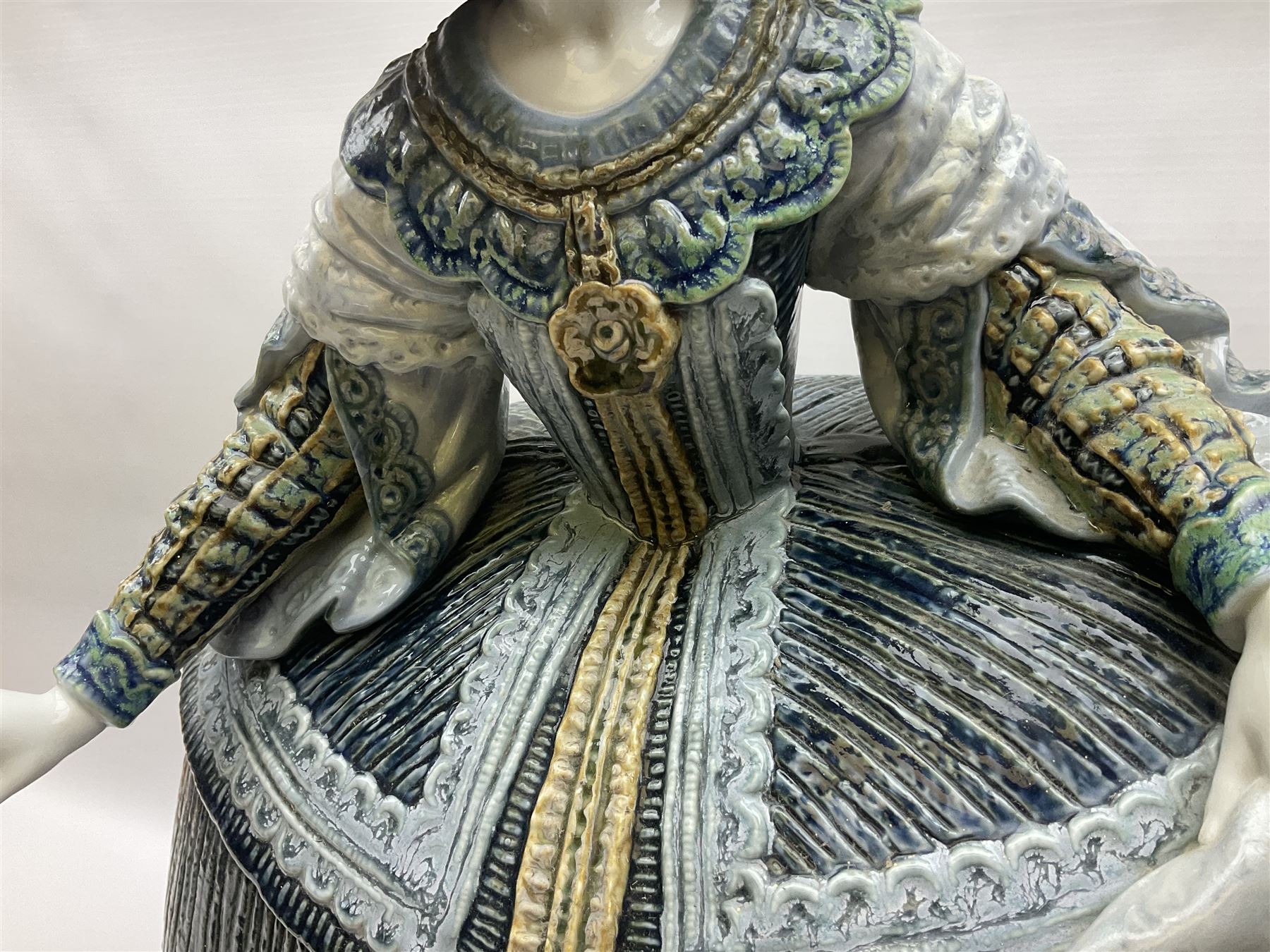 Large Lladro figure, La Menina, modelled as a maid of honor in service, on a mahogany oval base, limited edition 99/1000, sculpted by Jose Puche, with certificate of authenticity, framed and glazed, no 1812, year issued 1996, year retired 2019, H60cm