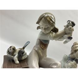 Four Lladro figures, comprising Sweet Dreams no 1535, Following Her Cats no 1309, Sleepy Kitten No 5712 and Pick of the Litter no 7621, all with original boxes, largest example H24cm