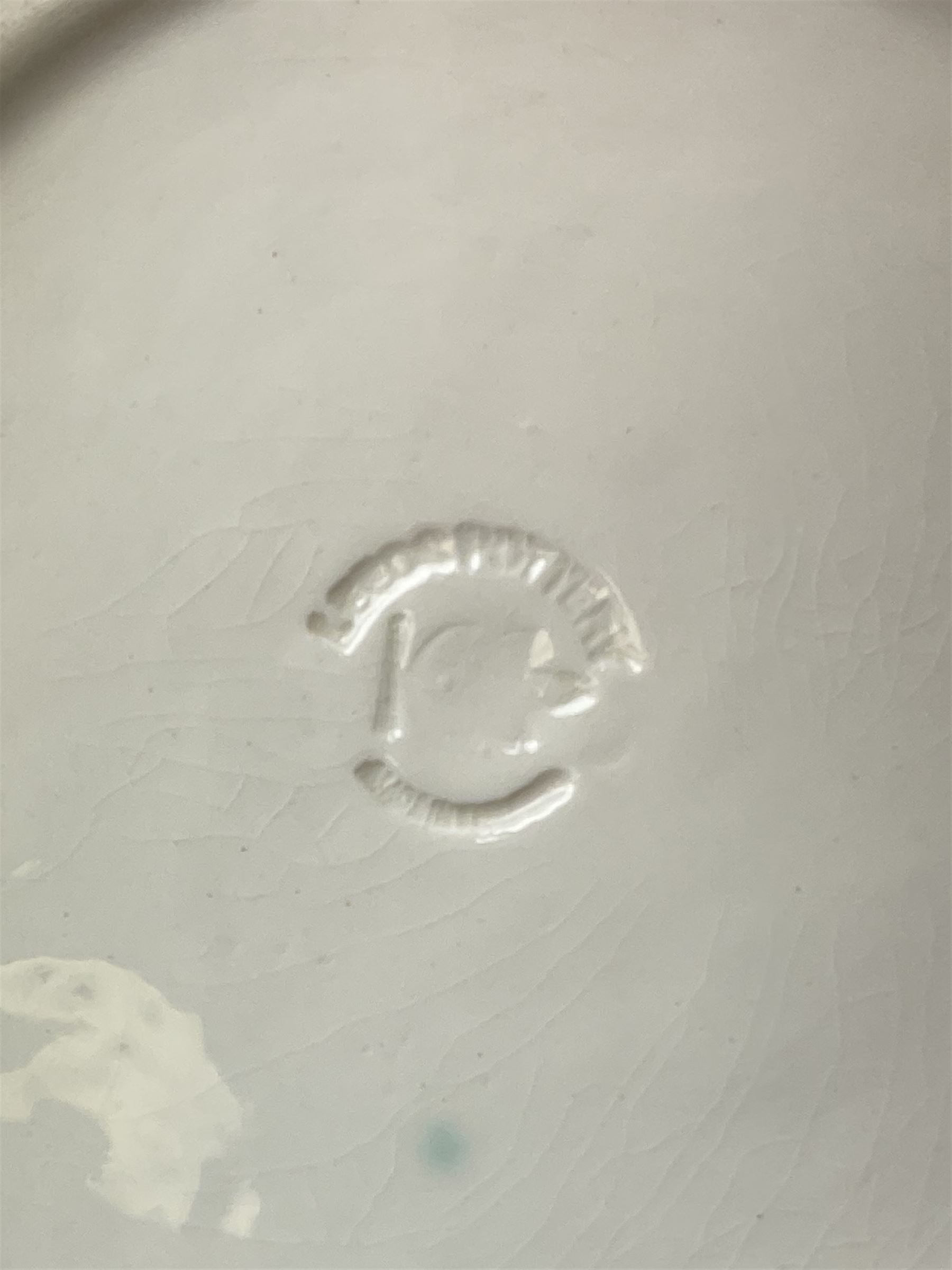 20th century Leeds creamware, comprising chestnut basket and stand, small tureen and cover, ladle, and associated stand, candlestick with stem modelled as a dolphin, teapot, tureen and cover in the form of a melon with fixed stand, and toast rack (toast rack a/f), each with impressed mark beneath. 