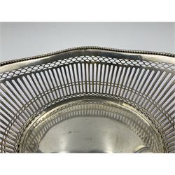 Early 20th century Dutch silver basket, of oval form with pierced sides, beaded rim, and twin handles, marked with Lion Passant for 2nd standard purity and date letter for 1910, other marks worn and indistinct, including handles H8.5cm L25.5cm