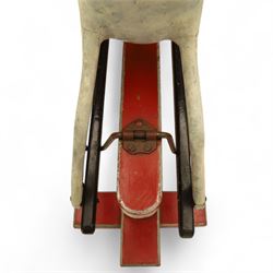 20th century carved and painted rocking horse, with original dappled paint finish, studded leather saddle and reins, on later red and black swing frame