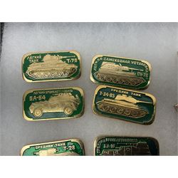 Nineteen Russian Soviet Tank Commemoration badges and medals, in small display case