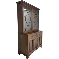 Acorn Industries - Georgian design mahogany bookcase on cupboard, fitted with two astragal glazed doors enclosing three glass shelves, base with two cock-beaded drawers over two panelled cupboards, inlaid with acorn signature, by Alan Grainger, Brandsby