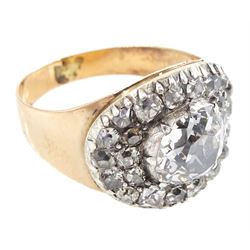 George III gold and silver old cut diamond cluster ring, the principal diamond of approx 0.75 carat, with pave set old cut diamond surround
