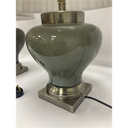 Pair of table lamps of squat baluster form, with a crackle glaze to a dark grey ground, upon a square base, including shade H57cm