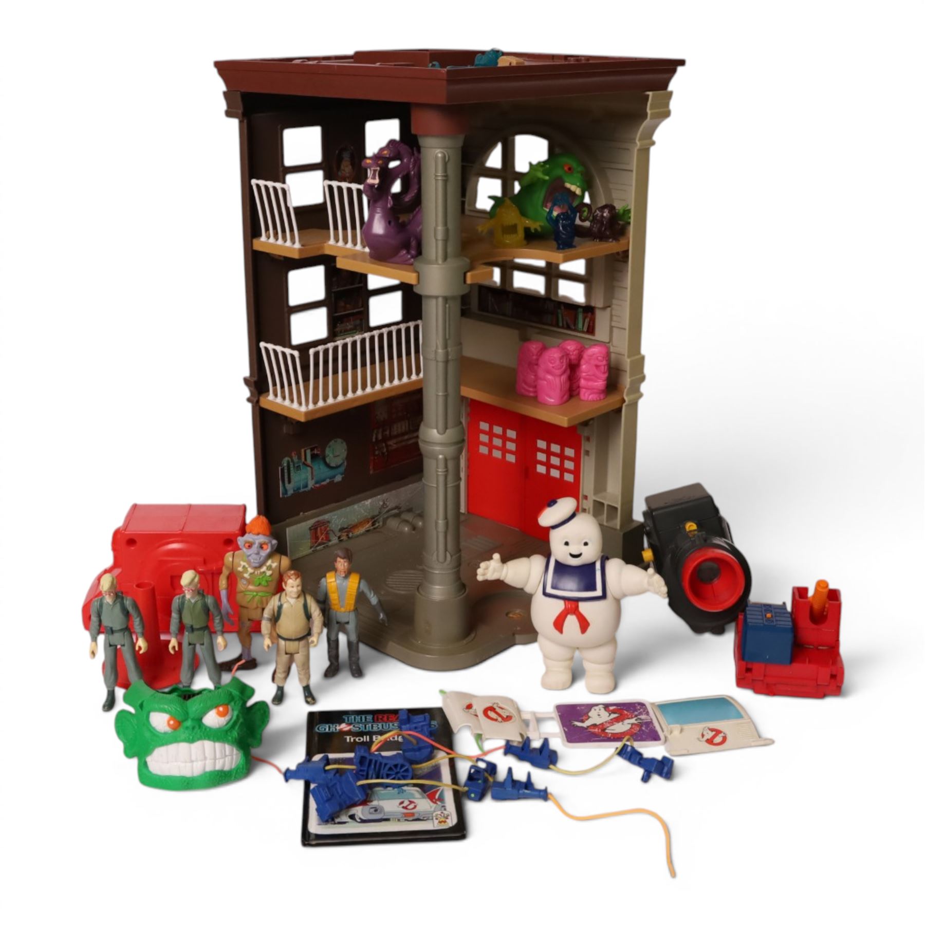 1980s Kenner The Real Ghostbusters toys, including Firehouse Headquarters playset and figures, Stay Puft Marshmallow Man and Slimer, Brain Blaster Ghost and Ghostzapper