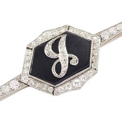 Early 20th century platinum black onyx and diamond initial brooch, single hexagon shaped black onyx with applied diamond set J, with a milgrain set, old cut diamond surround and bars, total diamond weight approx 0.95 carat