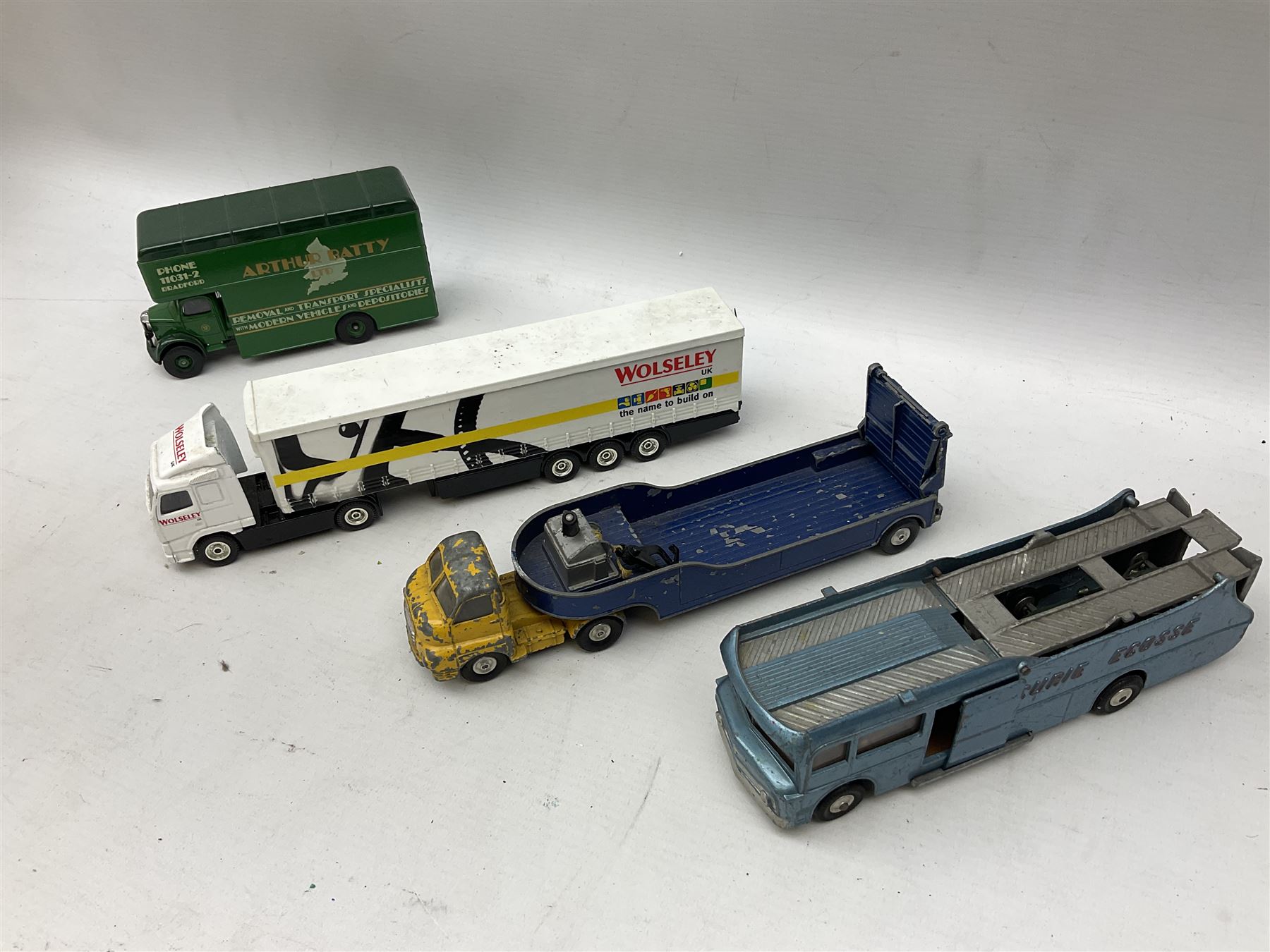 Corgi - eighteen unboxed and playworn/repainted die-cast commercial vehicles including Commer 5-Ton Wagon with drop-side trailer and two other 5-Ton wagons, Dodge Key Fargo, Jeep FC-150, two London Routemaster buses, Carrimore Trideck Transporter, two Carrimore Mark IV Transporters, Carrimore Low Loader, Ecurie Ecosse Racing Car Transporter etc (18)