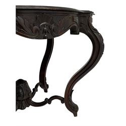 19th century Irish rosewood centre table, the shaped and moulded top over shaped apron carved with scrolled foliage, on serpentine supports carved with bell flowers, the supports united by anthemion carved finial and s-scroll x-framed stretchers