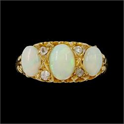 Early 20th century 18ct gold opal and diamond ring, three graduated oval cut opals, spaced...