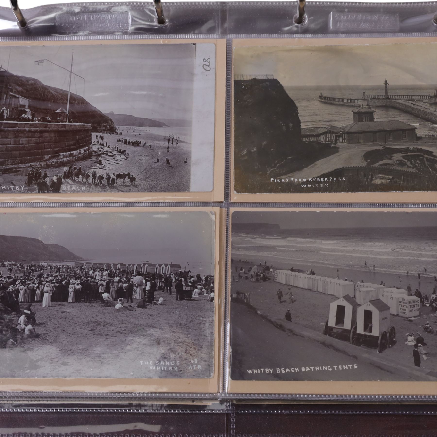 Five-hundred and thirty one late 19th and early 20th century real photographic postcards produced by J.T.Ross, depicting  daily life, village scenes, landmarks and street views of Whitby, the surrounding villages and South Teeside, including fifty-two modern copies, all housed within three postcard albums and accompanied by four copies of Ross, Photographer, Whitby 'The Life and Work of a Yorkshire Artist' by Colin Bullamore which provides a detailed overview of his life and work