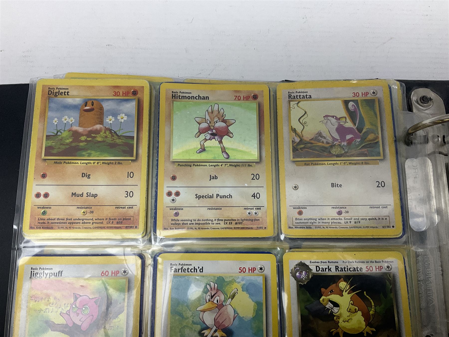 Collection of Pokemon trading cards, mostly 1999 Wizards Pokemon cards to include holo Charizard 4/102, first edition holo Machamp 8/102, further holographic cards; Dark Flareon 35/82 and Dark Vaporeon 45/82, cards from themed sets and 4th edition prints; 1998 Electronic Pokédex with cardboard boxes for themed decks Blackout, Overgrowth and Power Reserve Jungle, along with a large quantity of energy and trainer cards 