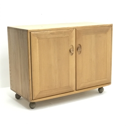 Ercol elm sideboard, two doors enclosing fitted interior on castors, W92cm, H71cm, D45cm