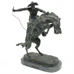 After Frederick Remington (American 1861-1909): 'Bronco Buster', limited edition bronze bearing signature and numbered 7/100, with foundry or ranch mark to horses backside of a triangle within circle, on green marble base, H56cm