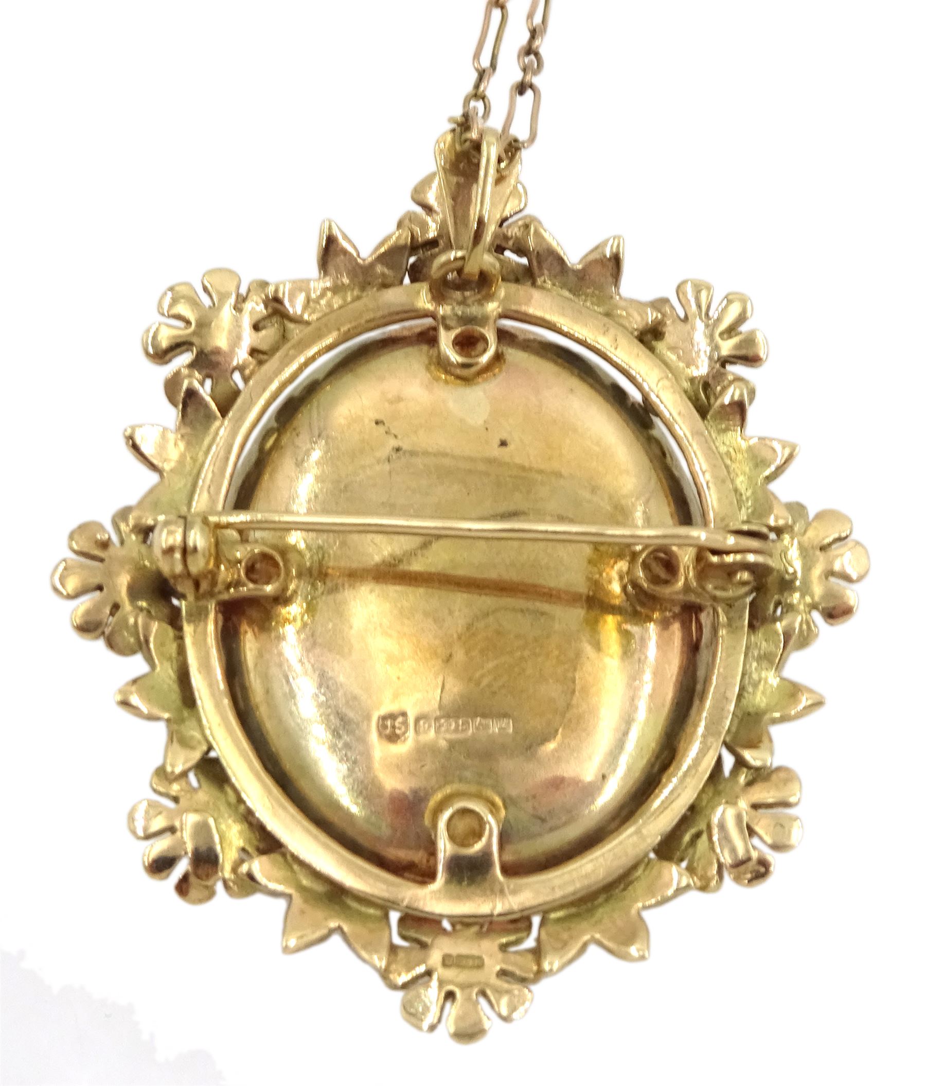 Gold hinged locket pendant/brooch, with foliate border, hallmarked, on 9ct gold link chain necklace