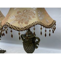 Pair bronzed amphora lamps with pineapple decoration, scroll handles and foliate base with scrolled feet together with pair peach ground shades and raised floral pattern H76cm (2)